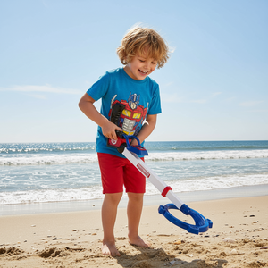 a child playing with a toy on a beach